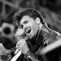 George Michael on stage for Wham's London concert in 1986